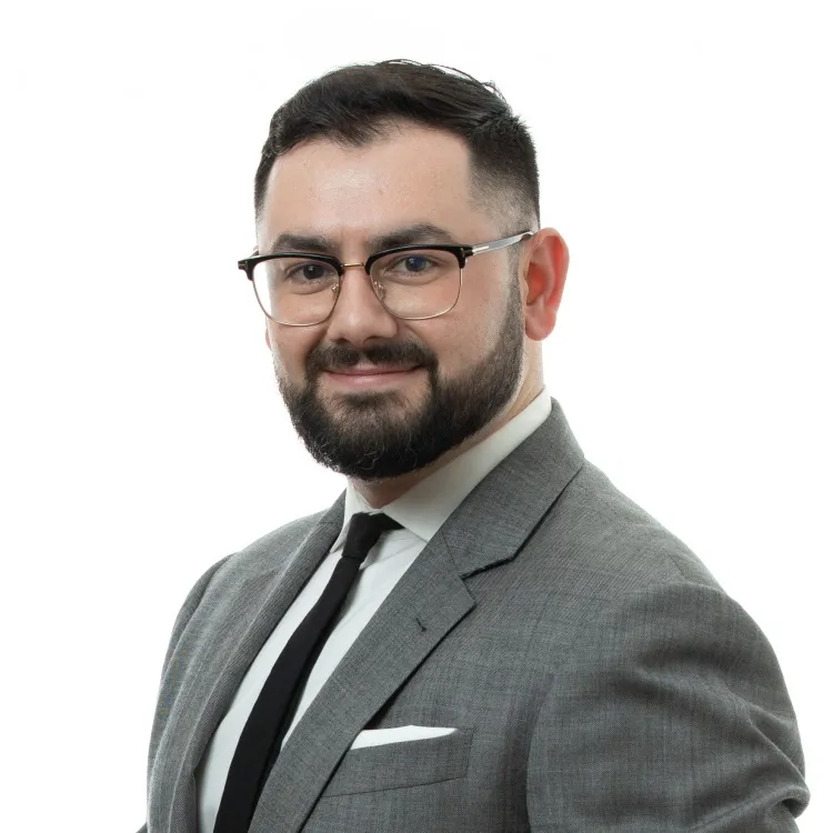 Travis J. Stockman, Esq.